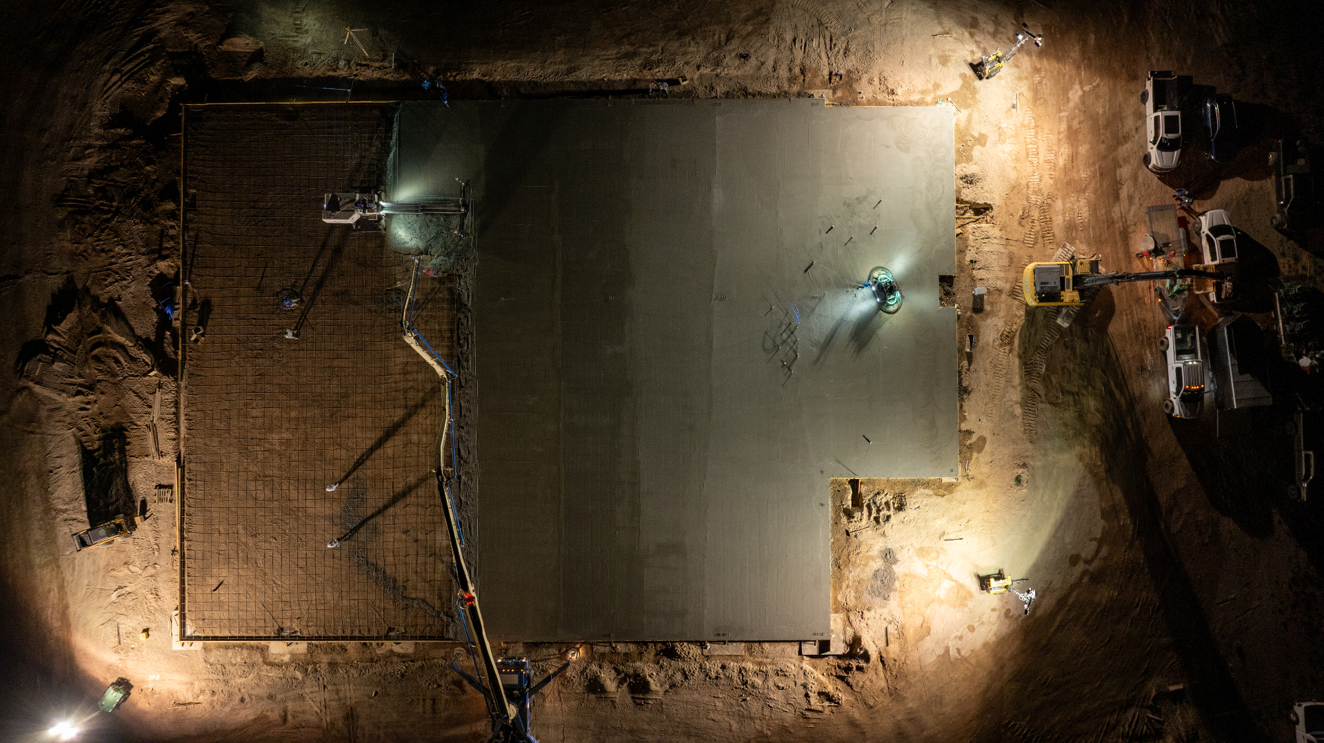 Aerial drone photo of a nighttime concrete foundation pour on a Southern Utah construction site